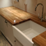 Shaker style cabinets with oak worktops and belfast sink