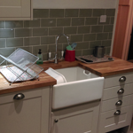 Shaker style cabinets with oak worktops and belfast sink